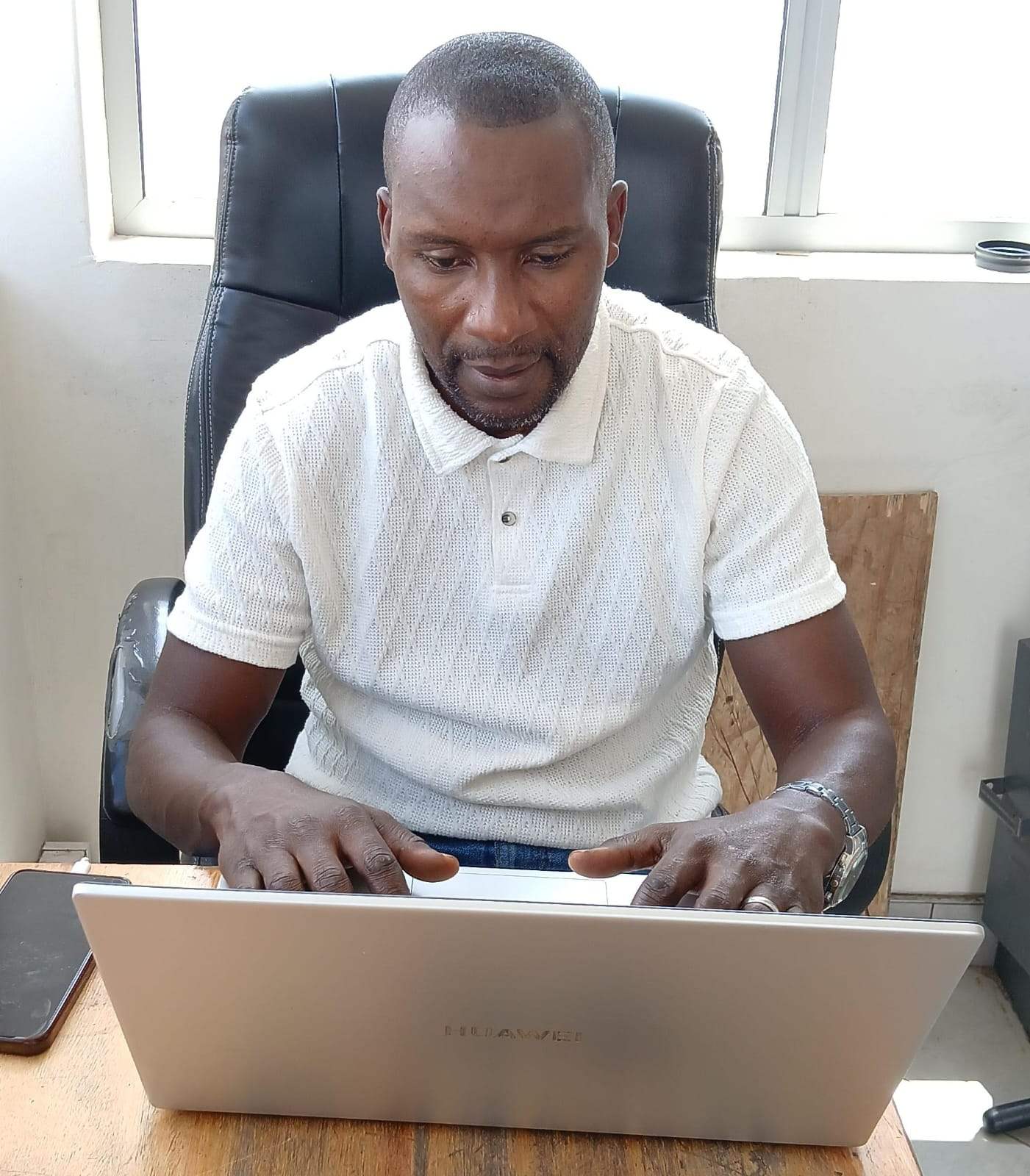 Adult students learning with laptops in South Africa